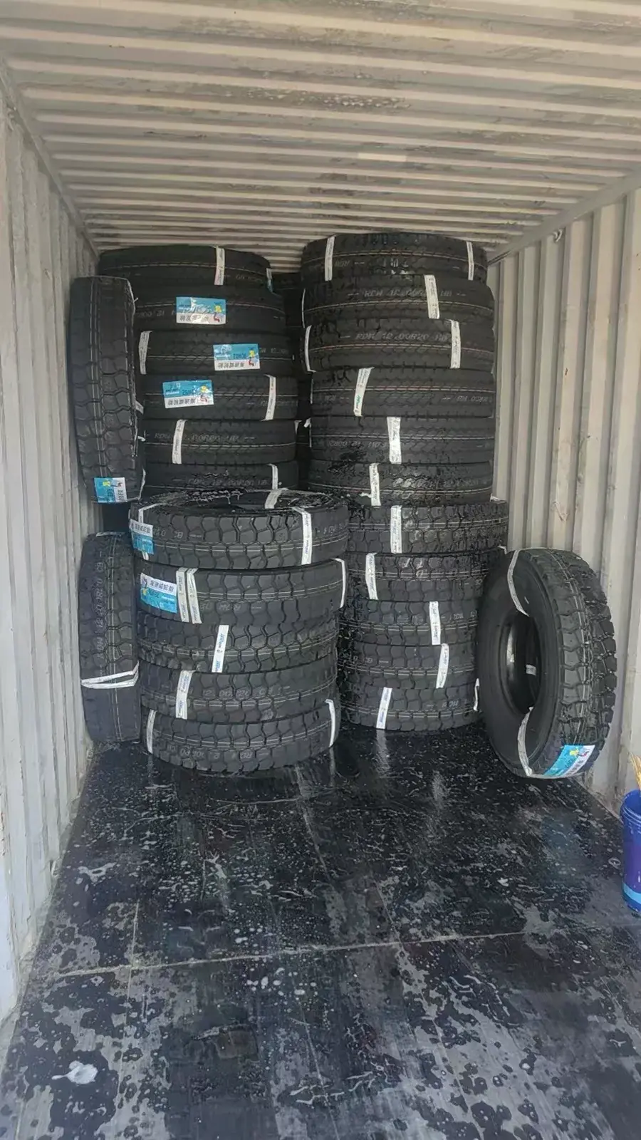 TBR truck tires loaded inside a shipping container