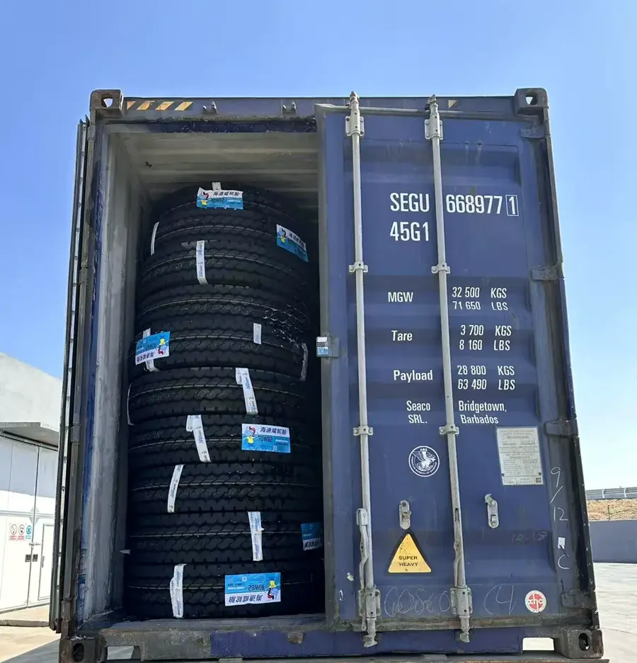 Container door view showing TBR truck tires loaded for export
